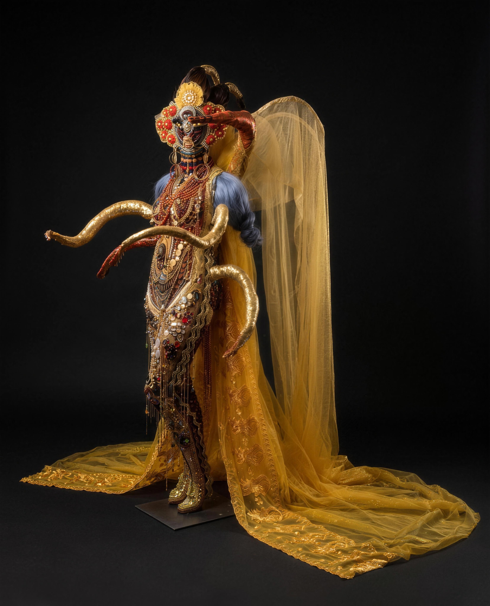 Gabriela Rising, 2023 life-sized sculpture in gold and jeweled regalia